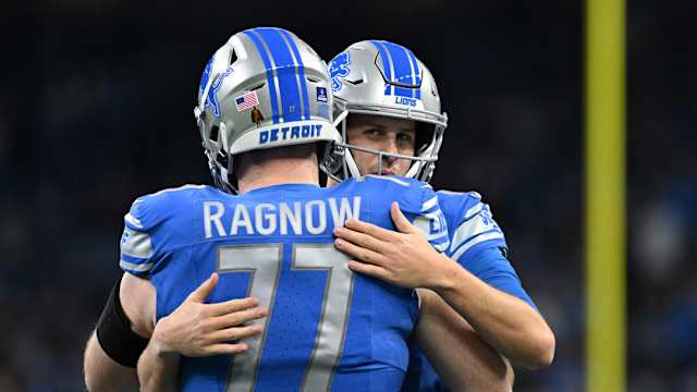 Detroit Lions quarterback Jared Goff greets center Frank Ragnow